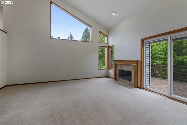15917 NE Union Rd, Ridgefield, WA 98642 - unfurnished living room with healthy amount of natural light, carpet floors, baseboards, a high end fireplace, and high vaulted ceiling