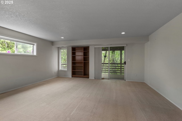 15917 NE Union Rd, Ridgefield, WA 98642 - carpeted empty room featuring plenty of natural light, recessed lighting, baseboards, and a textured ceiling