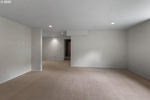 15917 NE Union Rd, Ridgefield, WA 98642 - empty room with recessed lighting, light colored carpet, baseboards, and a textured ceiling
