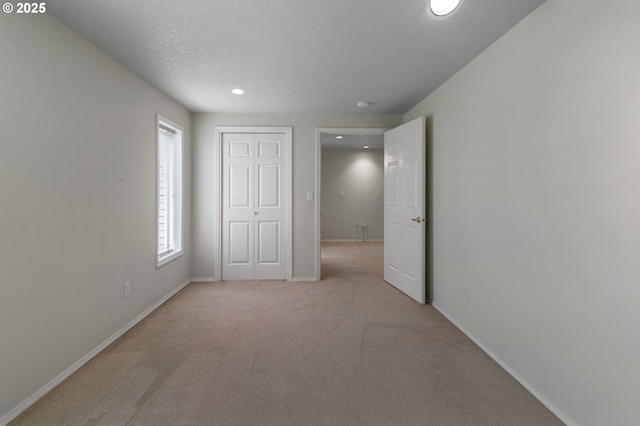 15917 NE Union Rd, Ridgefield, WA 98642 - unfurnished bedroom featuring recessed lighting, light colored carpet, baseboards, and a closet