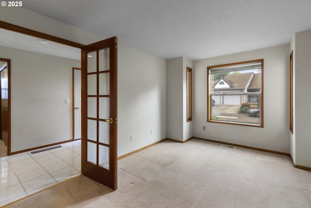 15917 NE Union Rd, Ridgefield, WA 98642 - unfurnished room with baseboards, french doors, and carpet flooring
