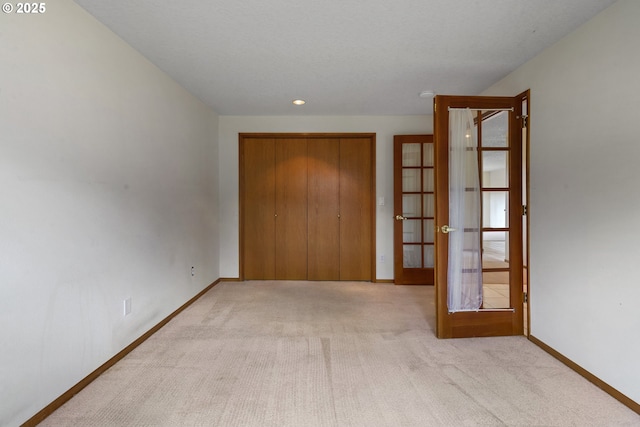 15917 NE Union Rd, Ridgefield, WA 98642 - hallway featuring french doors, baseboards, carpet floors, and recessed lighting