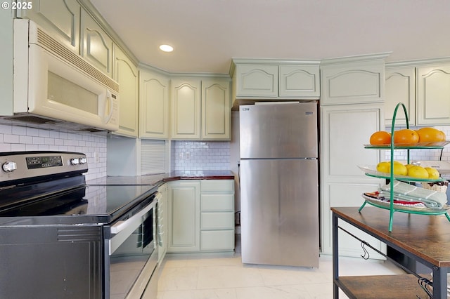 kitchen featuring appliances with stainless steel finishes and backsplash