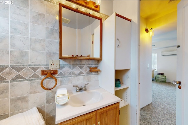 bathroom featuring a wall unit AC, vanity, and decorative backsplash