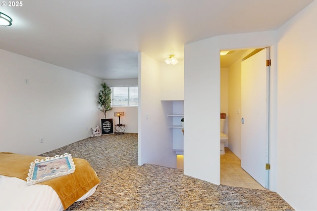 bedroom with light colored carpet