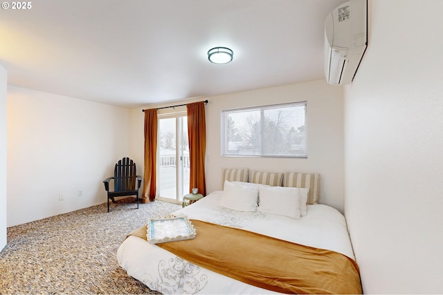 bedroom featuring carpet, access to exterior, and a wall mounted air conditioner