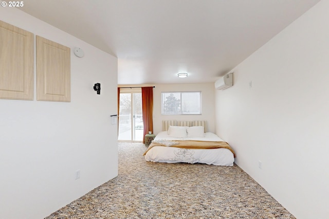 carpeted bedroom featuring a wall unit AC and access to outside