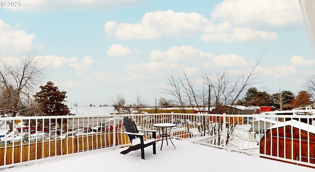 view of snow covered deck