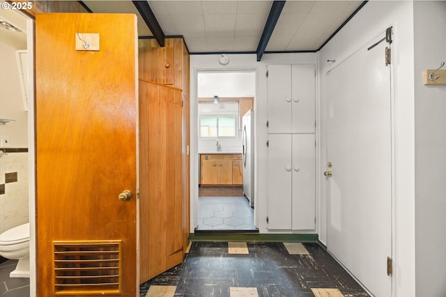 12405 SW Faircrest St, Portland, OR 97225 - hallway featuring dark floors and beamed ceiling