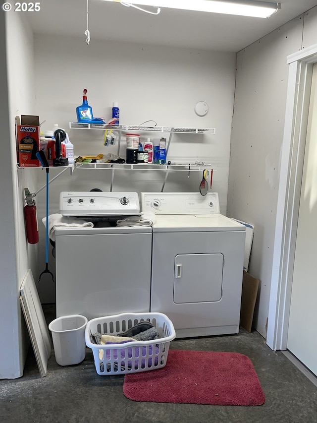 clothes washing area with laundry area and separate washer and dryer