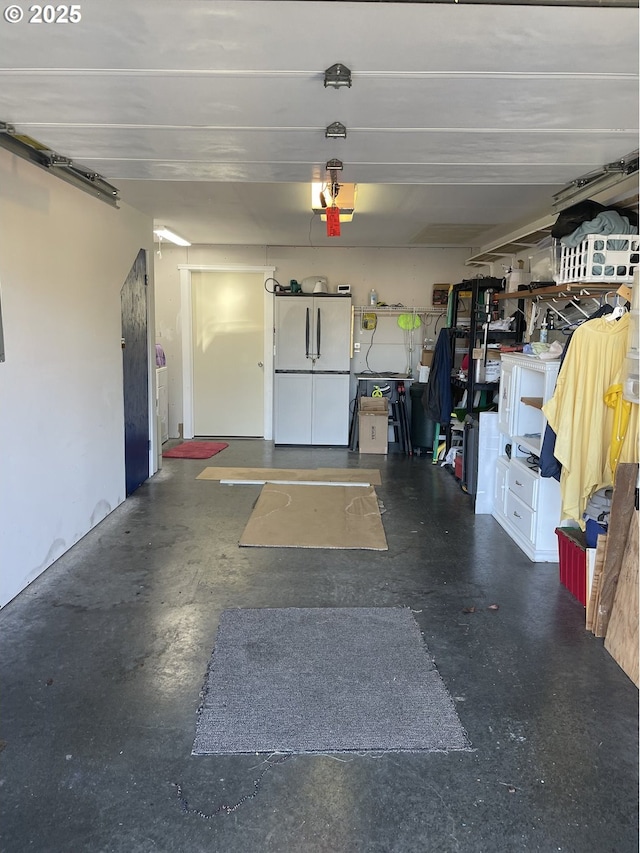 garage with freestanding refrigerator
