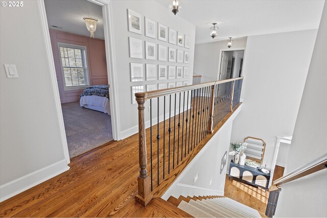 14218 NW Dunbar Ln, Portland, OR 97231 - stairs with wood finished floors and baseboards