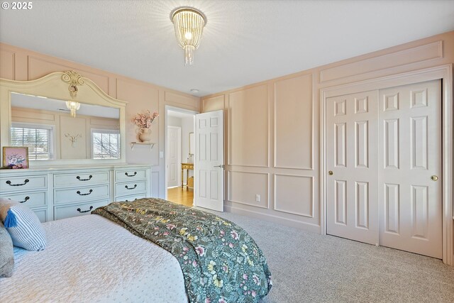 carpeted bedroom featuring a closet