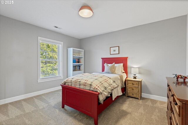 14218 NW Dunbar Ln, Portland, OR 97231 - bedroom featuring a decorative wall, a wainscoted wall, light carpet, multiple windows, and a ceiling fan