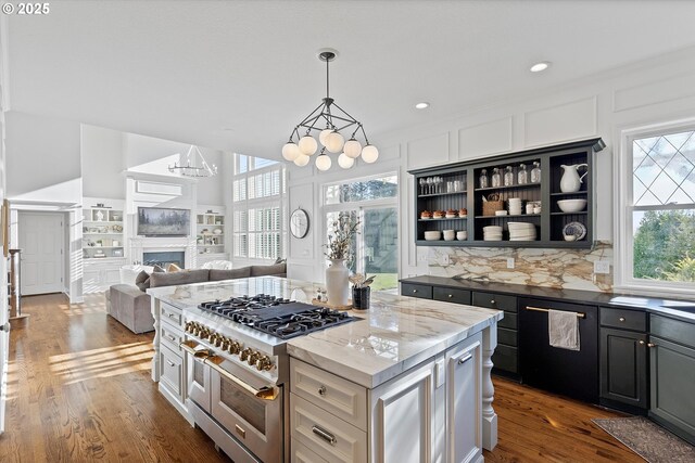 14218 NW Dunbar Ln, Portland, OR 97231 - kitchen featuring open floor plan, dark wood-style flooring, range with two ovens, a center island, and a chandelier