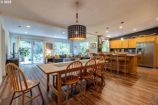 8836 SW 56th Ave, Portland, OR 97219 - dining space with wood finished floors, a textured ceiling, and recessed lighting