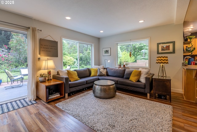 8836 SW 56th Ave, Portland, OR 97219 - living area with plenty of natural light, wood finished floors, and recessed lighting