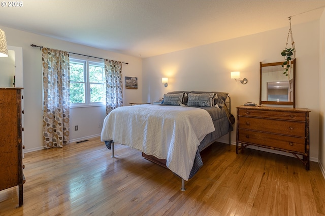 8836 SW 56th Ave, Portland, OR 97219 - bedroom featuring light wood finished floors and baseboards