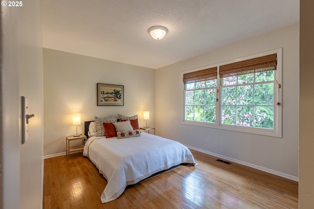 8836 SW 56th Ave, Portland, OR 97219 - bedroom featuring baseboards and wood finished floors