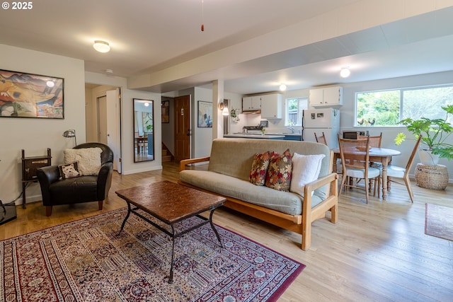 8836 SW 56th Ave, Portland, OR 97219 - living room with light wood-style flooring and stairway