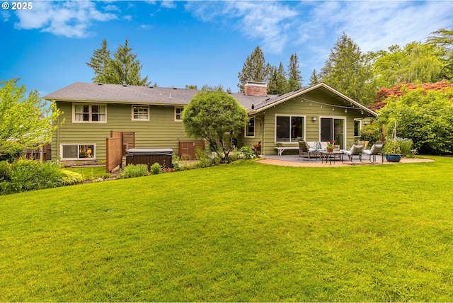 8836 SW 56th Ave, Portland, OR 97219 - rear view of house with a hot tub, a patio area, a chimney, and a yard