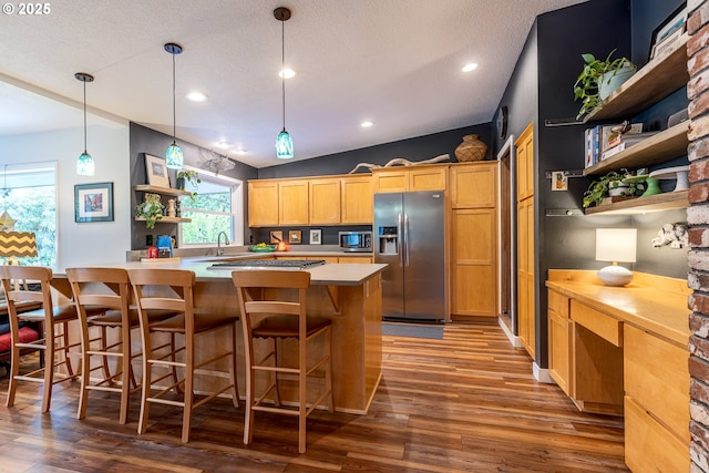 8836 SW 56th Ave, Portland, OR 97219 - kitchen featuring stainless steel appliances, open shelves, light countertops, healthy amount of natural light, and recessed lighting