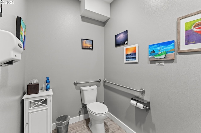 33310 Cape Kiwanda Dr, Pacific City, OR 97135 - bathroom with toilet, wood finished floors, and baseboards