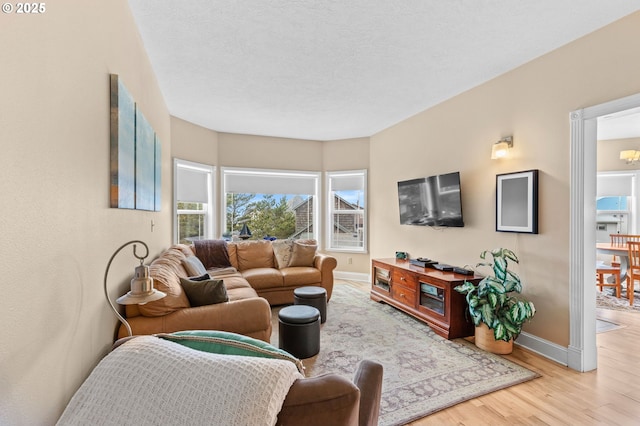 33310 Cape Kiwanda Dr, Pacific City, OR 97135 - living area featuring light wood-type flooring and baseboards