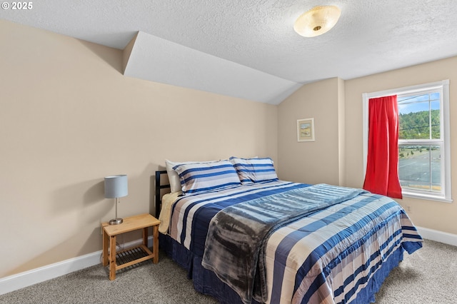 33310 Cape Kiwanda Dr, Pacific City, OR 97135 - carpeted bedroom featuring baseboards, a textured ceiling, and lofted ceiling