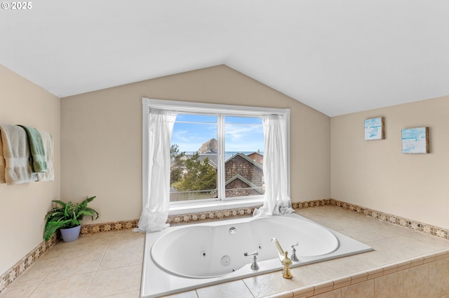 33310 Cape Kiwanda Dr, Pacific City, OR 97135 - bathroom with a whirlpool tub, vaulted ceiling, and baseboards