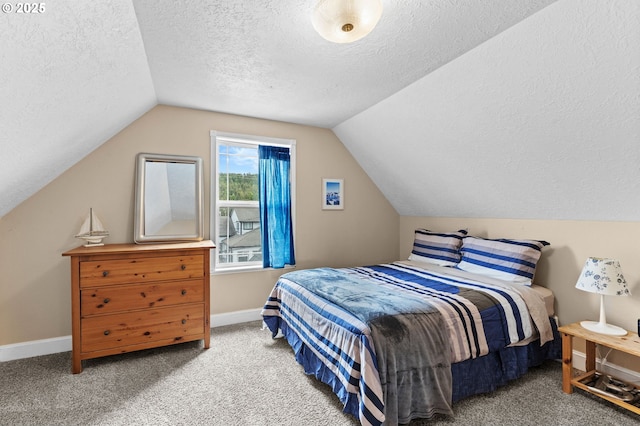 33310 Cape Kiwanda Dr, Pacific City, OR 97135 - bedroom featuring a textured ceiling, lofted ceiling, baseboards, and carpet flooring