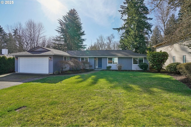 ranch-style home featuring driveway, a garage, and a front yard