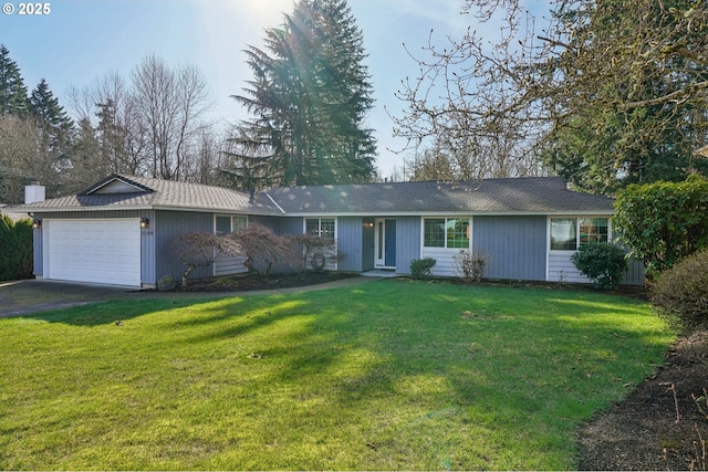 ranch-style house featuring a garage, aphalt driveway, and a front lawn