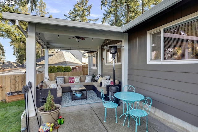 view of patio featuring ceiling fan and an outdoor living space