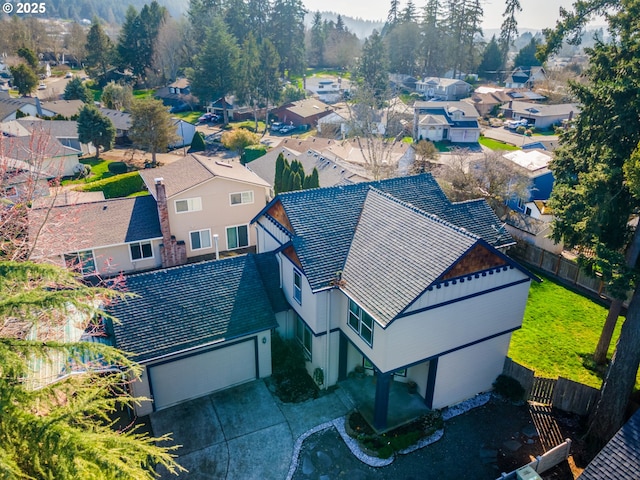 birds eye view of property with a residential view