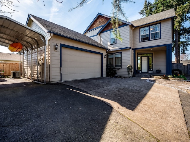 view of front of property with a garage, central AC unit, driveway, and fence