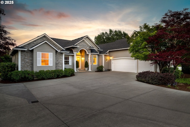 20905 NE 96th Ave, Battle Ground, WA 98604 - single story home featuring stone siding, a garage, and driveway