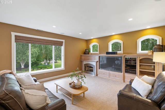 20905 NE 96th Ave, Battle Ground, WA 98604 - carpeted living area with wine cooler, baseboards, recessed lighting, plenty of natural light, and a fireplace with flush hearth