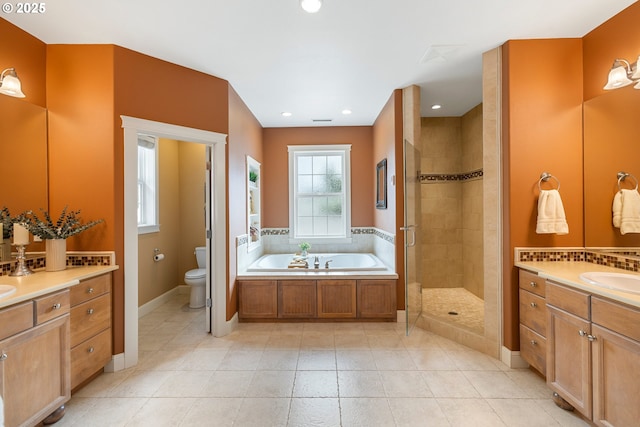 20905 NE 96th Ave, Battle Ground, WA 98604 - full bath featuring toilet, a shower stall, two vanities, a bath, and tile patterned flooring