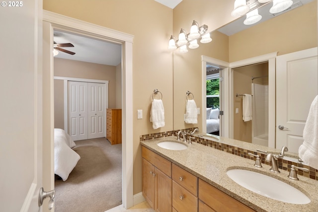 20905 NE 96th Ave, Battle Ground, WA 98604 - ensuite bathroom featuring double vanity, shower / tub combination, a ceiling fan, and baseboards