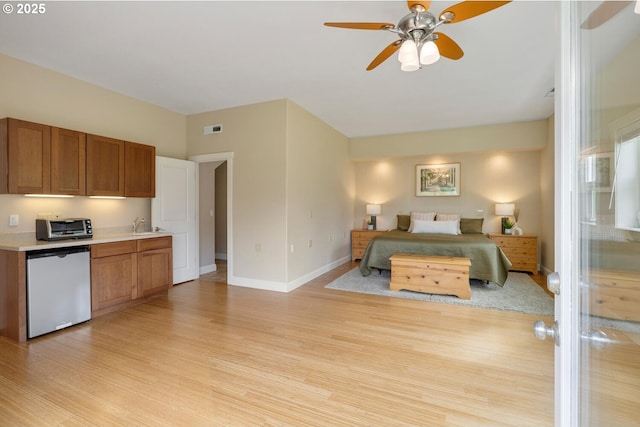 20905 NE 96th Ave, Battle Ground, WA 98604 - bedroom featuring light wood-type flooring, baseboards, a sink, and a ceiling fan
