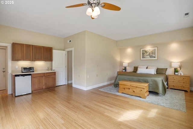 20905 NE 96th Ave, Battle Ground, WA 98604 - bedroom with light wood-style flooring, a sink, baseboards, and ceiling fan