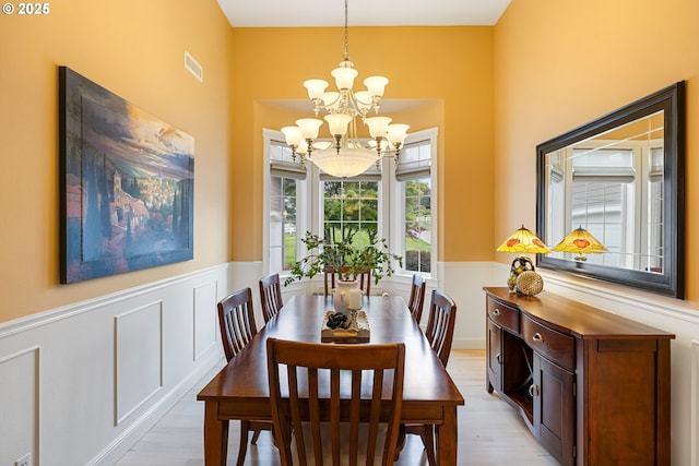 20905 NE 96th Ave, Battle Ground, WA 98604 - dining room with a chandelier, wainscoting, and light wood-type flooring