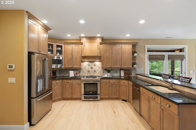 20905 NE 96th Ave, Battle Ground, WA 98604 - kitchen featuring appliances with stainless steel finishes, custom exhaust hood, a sink, open shelves, and a peninsula