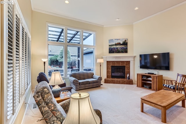 living room with ornamental molding, a fireplace, and light carpet