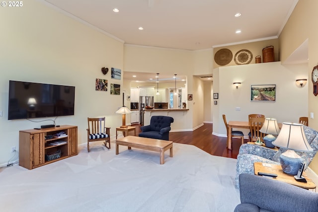 living room with hardwood / wood-style flooring and ornamental molding