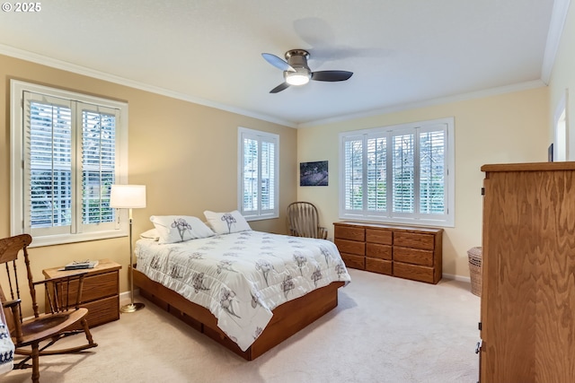 carpeted bedroom with crown molding and ceiling fan