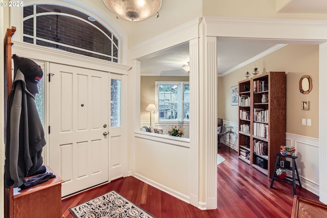 foyer featuring crown molding and wood-type flooring