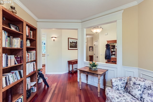 living area with ornamental molding and dark hardwood / wood-style floors