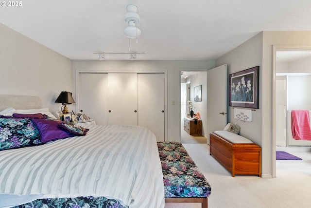 4825 SE 33rd Ave, Portland, OR 97202 - carpeted bedroom featuring a closet, track lighting, and ensuite bathroom